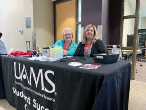 ESSC Learning Specialist Marjoree Harper (left) and Dana Pickett, ESSC administrative assistant, staff the ESSC table at the Graduate School Orientation on Aug. 9.