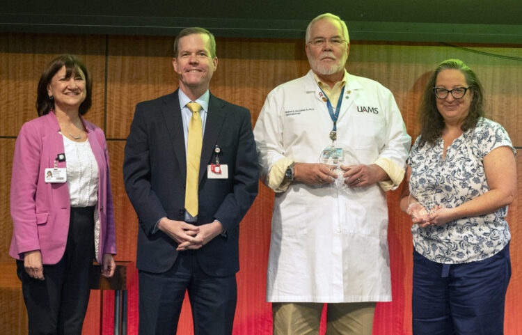 (From left) Stephanie Gardner, provost and chief strategy officer; Chancellor Cam Patterson, and award recipients Robert E. (Bobby) McGehee, Jr., and Misty L. Virmani. Award recipients Tiffany F. Haynes, Pearl A. McElfish, and Kevin D. Phelan were not able to attend the town hall.