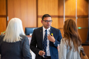 Amit Tiwari, Ph.D., who recently joined UAMS as the associate dean of research and graduate studies in the College of Pharmacy, visits during the New Faculty Reception.